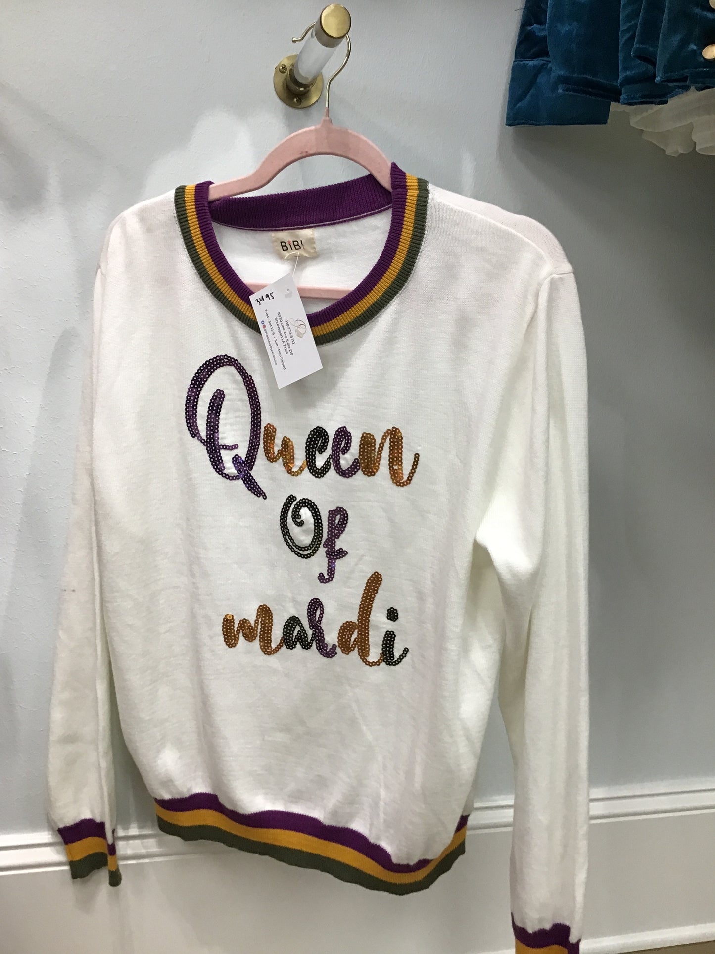 Sequined “Queen of Mardi” long sleeve sweater