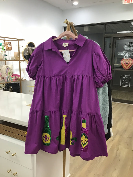 Purple Mardi Gras dress with sequined bottles and fleur de lis